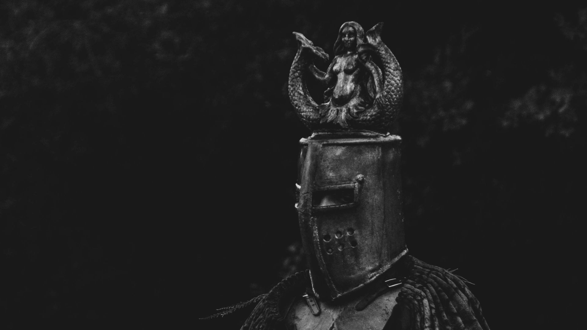 a black and white photo of a knight