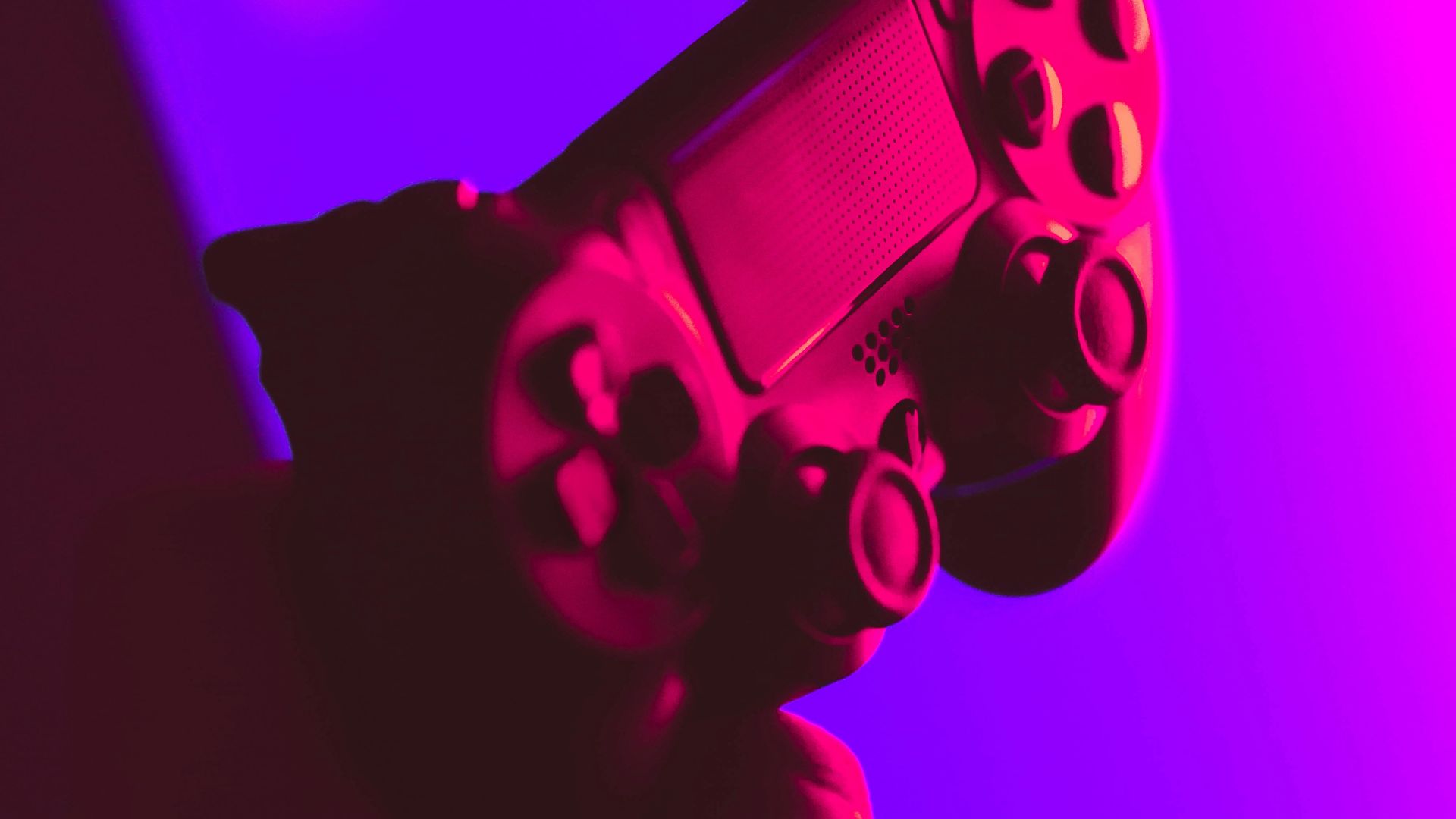 person holding black and gray game controller