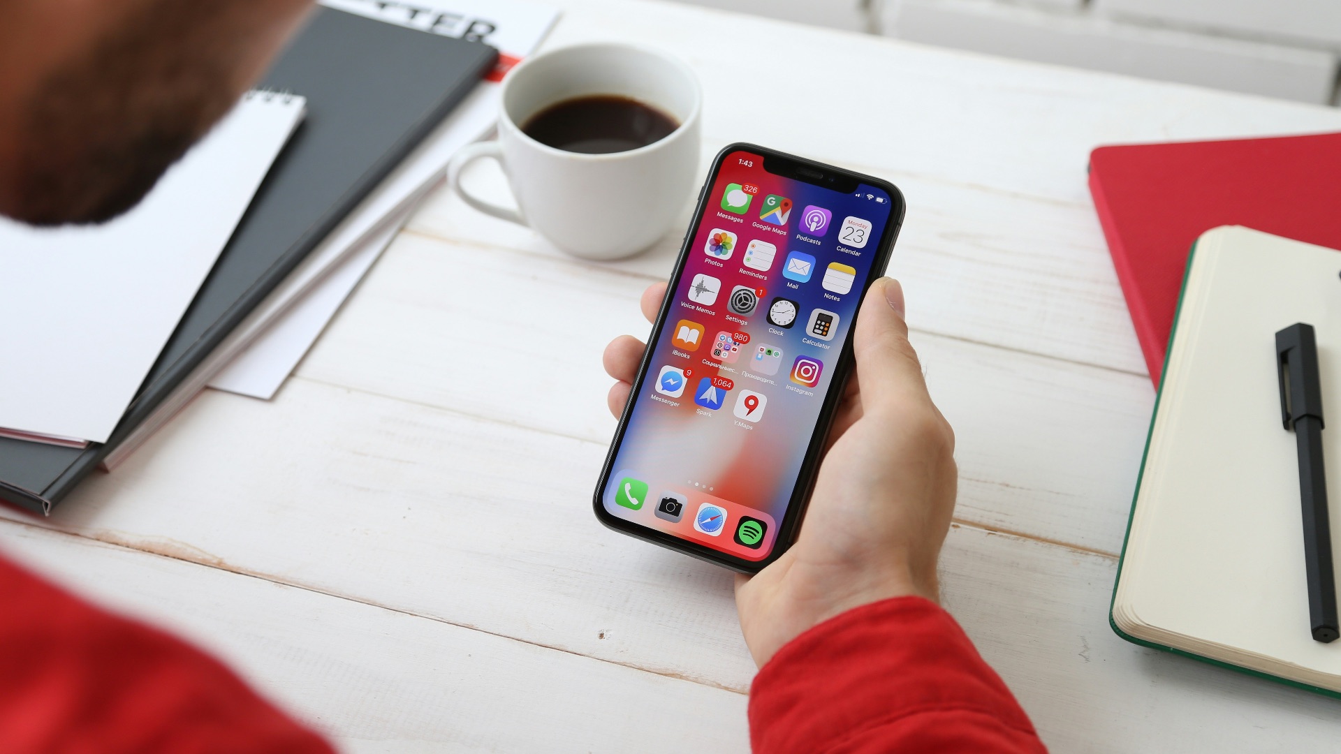 person holding space gray iPhone X