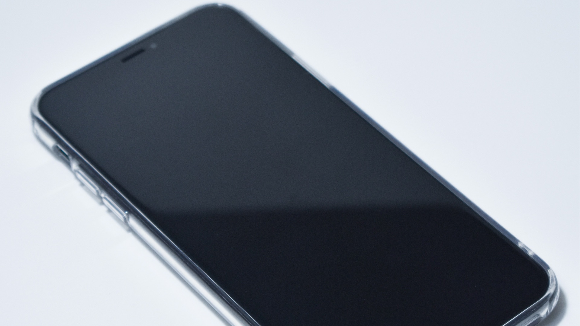 black android smartphone on white surface