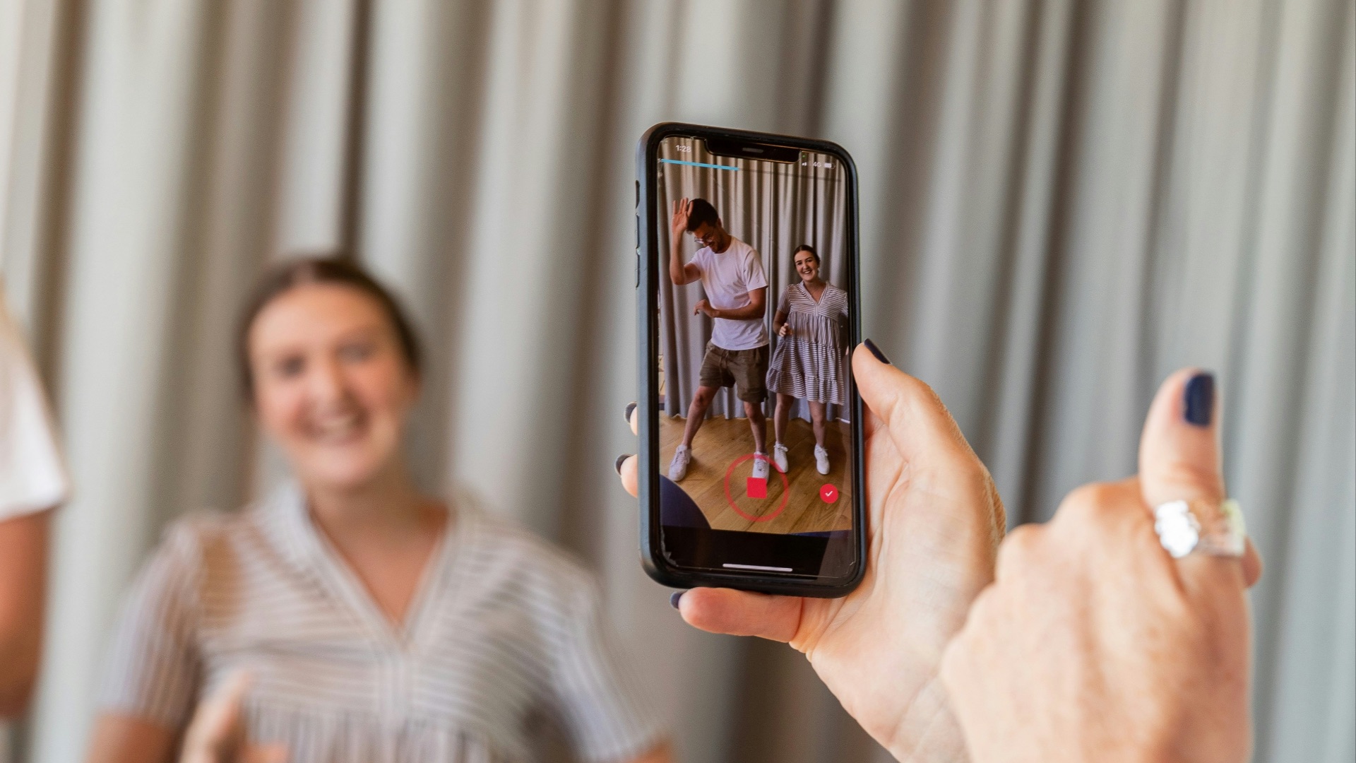 a woman holding a picture of a man