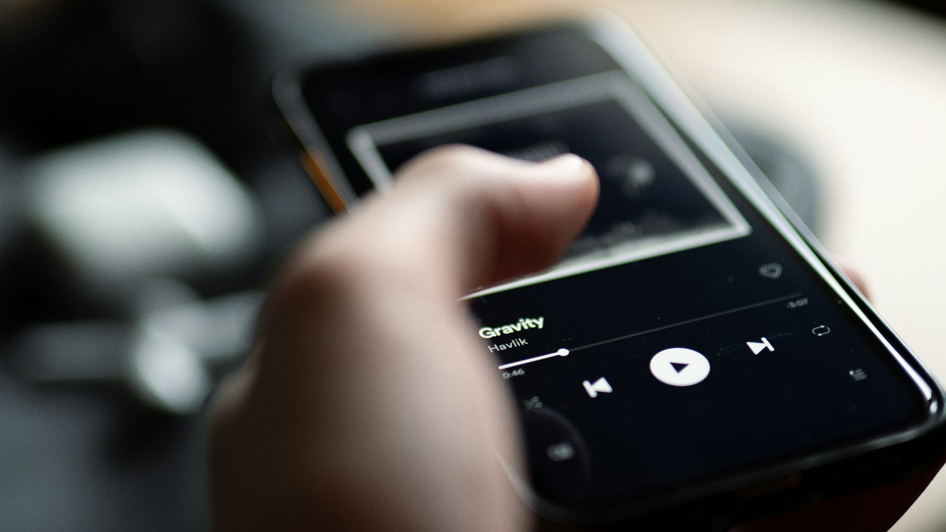 person holding black sony digital device