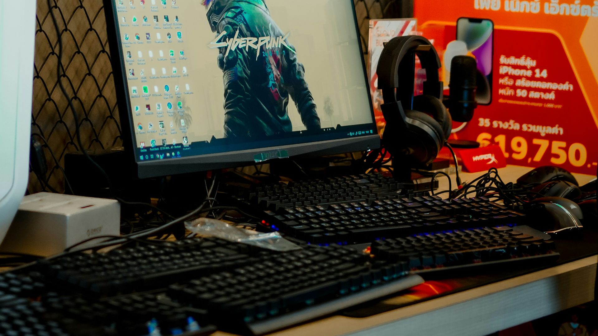 a desk with a computer and headphones on it
