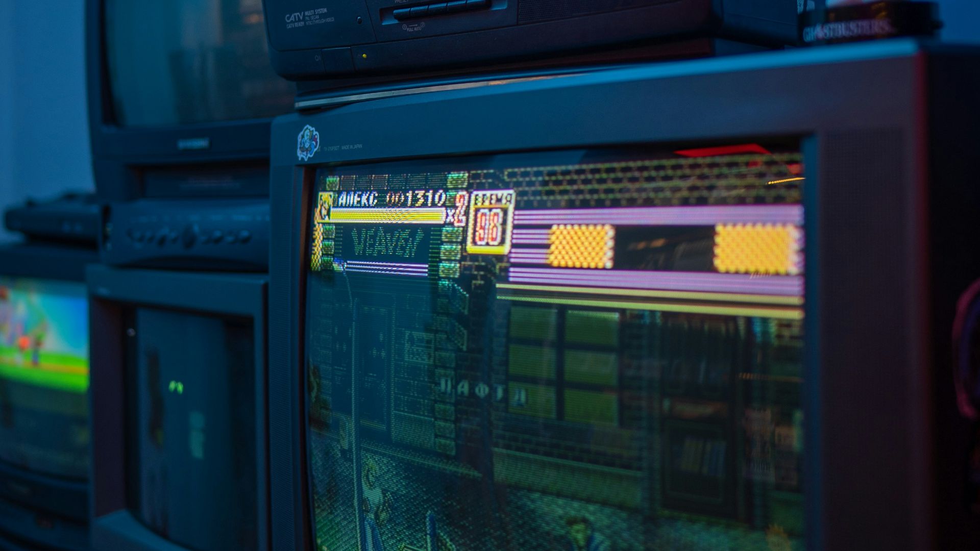 black crt tv turned on on brown wooden tv rack