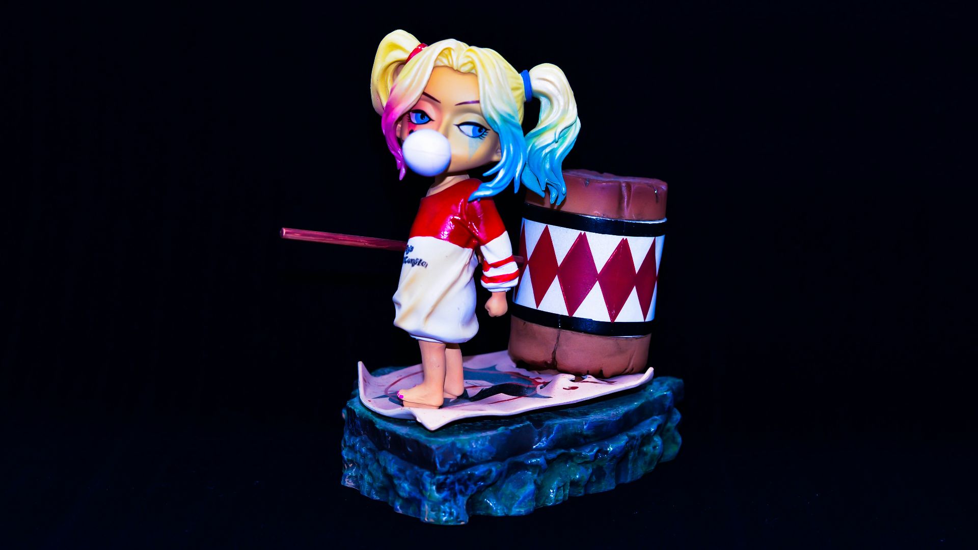 yellow haired girl in red and white dress holding red and white gift box