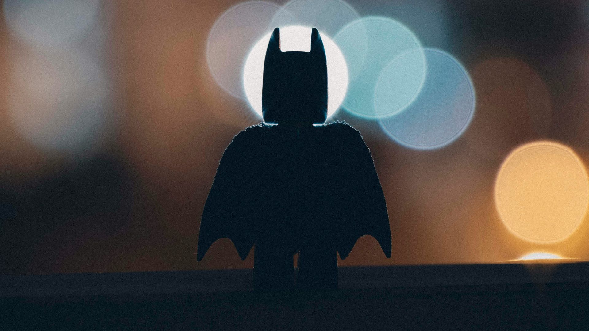 silhouette of person standing on the road during night time