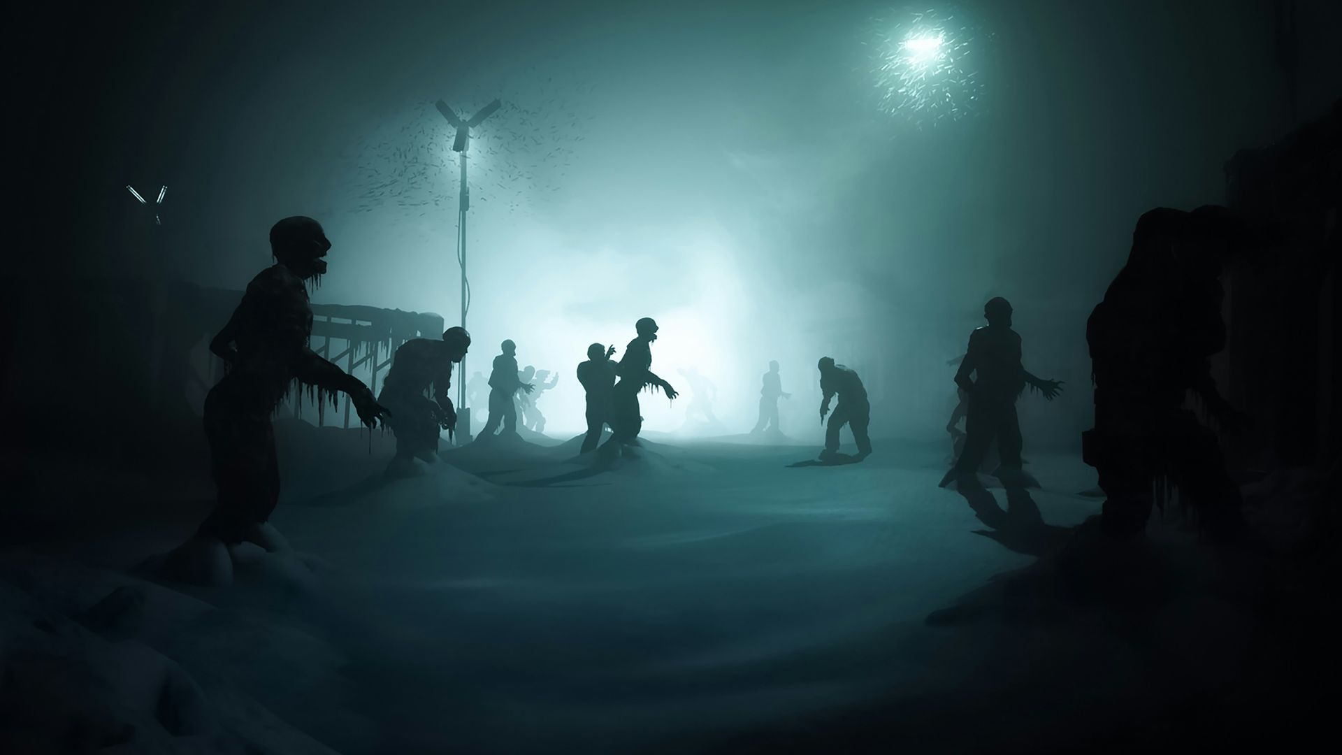 a group of people standing in the snow at night