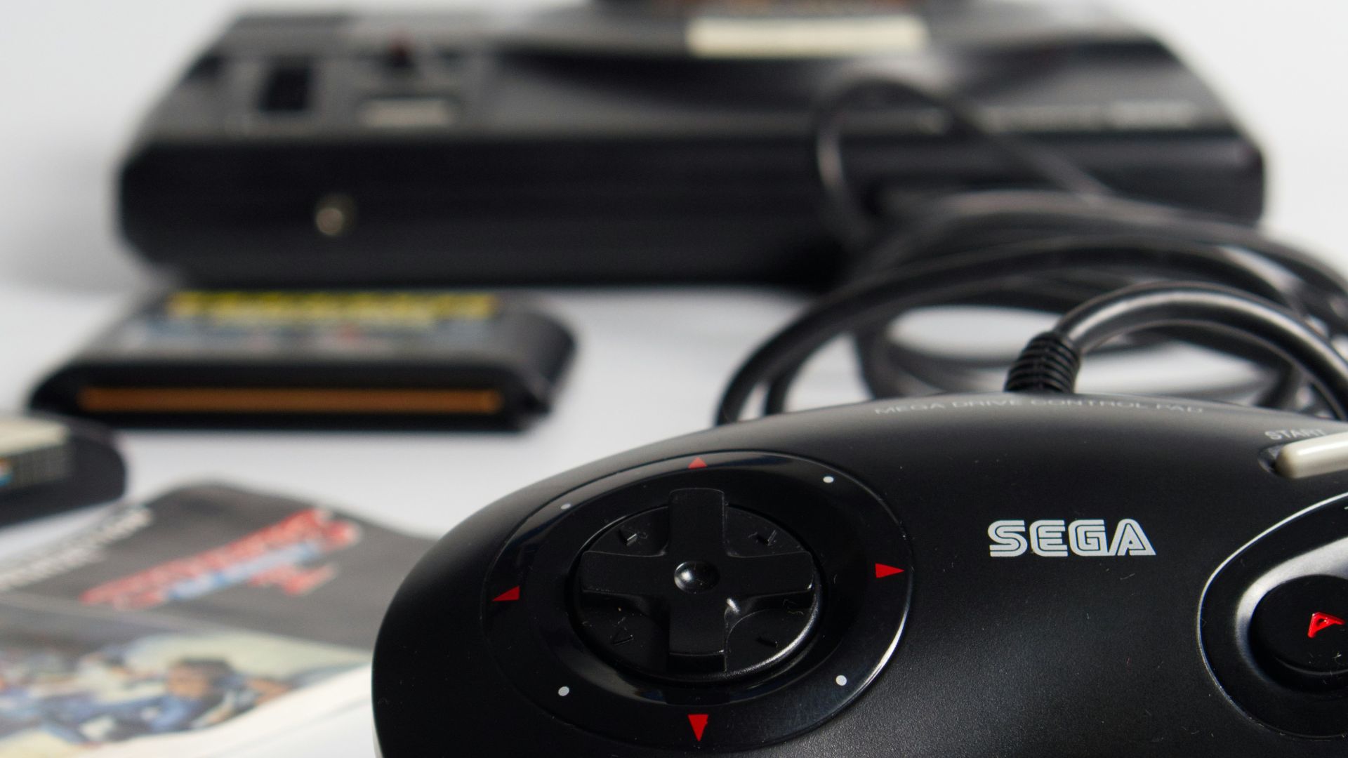 black game controller on white table