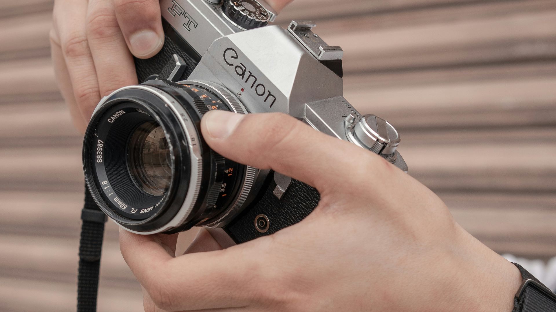 a person holding a camera in their hand