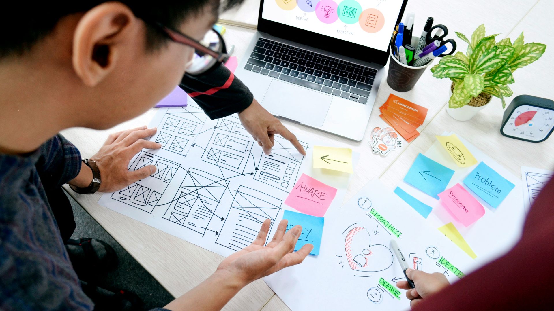 woman in black long sleeve shirt holding white paper