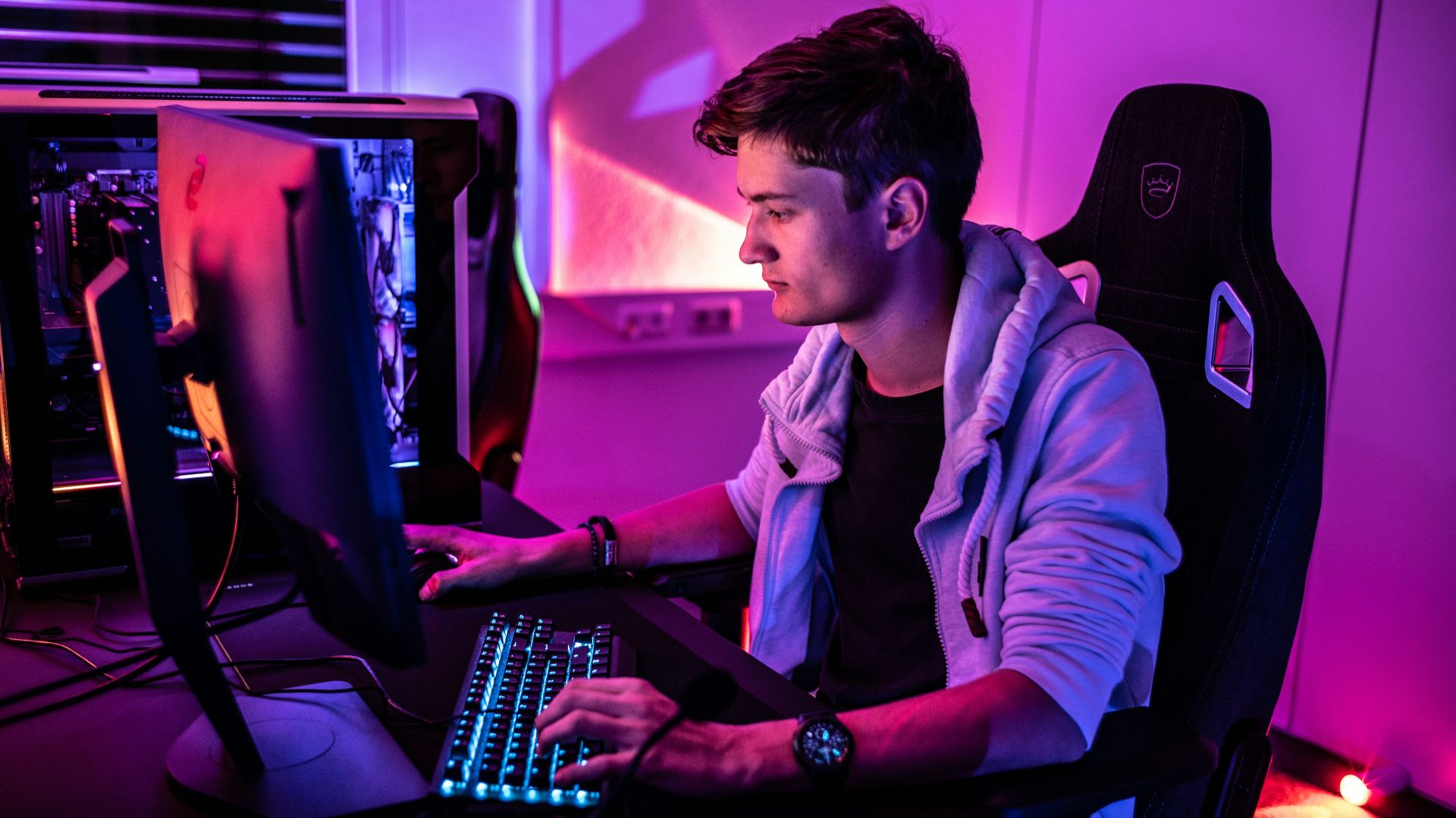 a man sitting in front of a computer keyboard