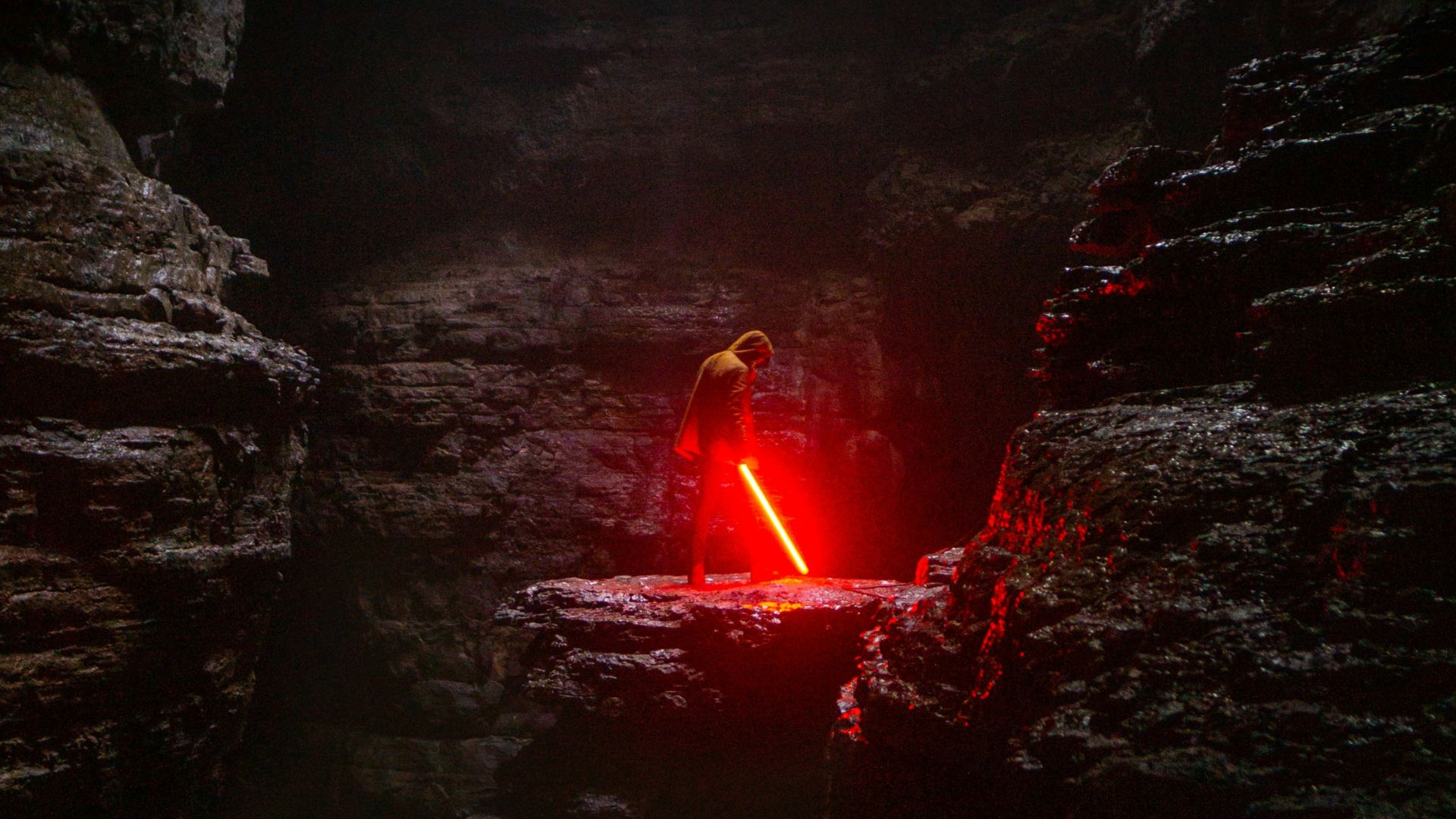 person holding red lightsaber