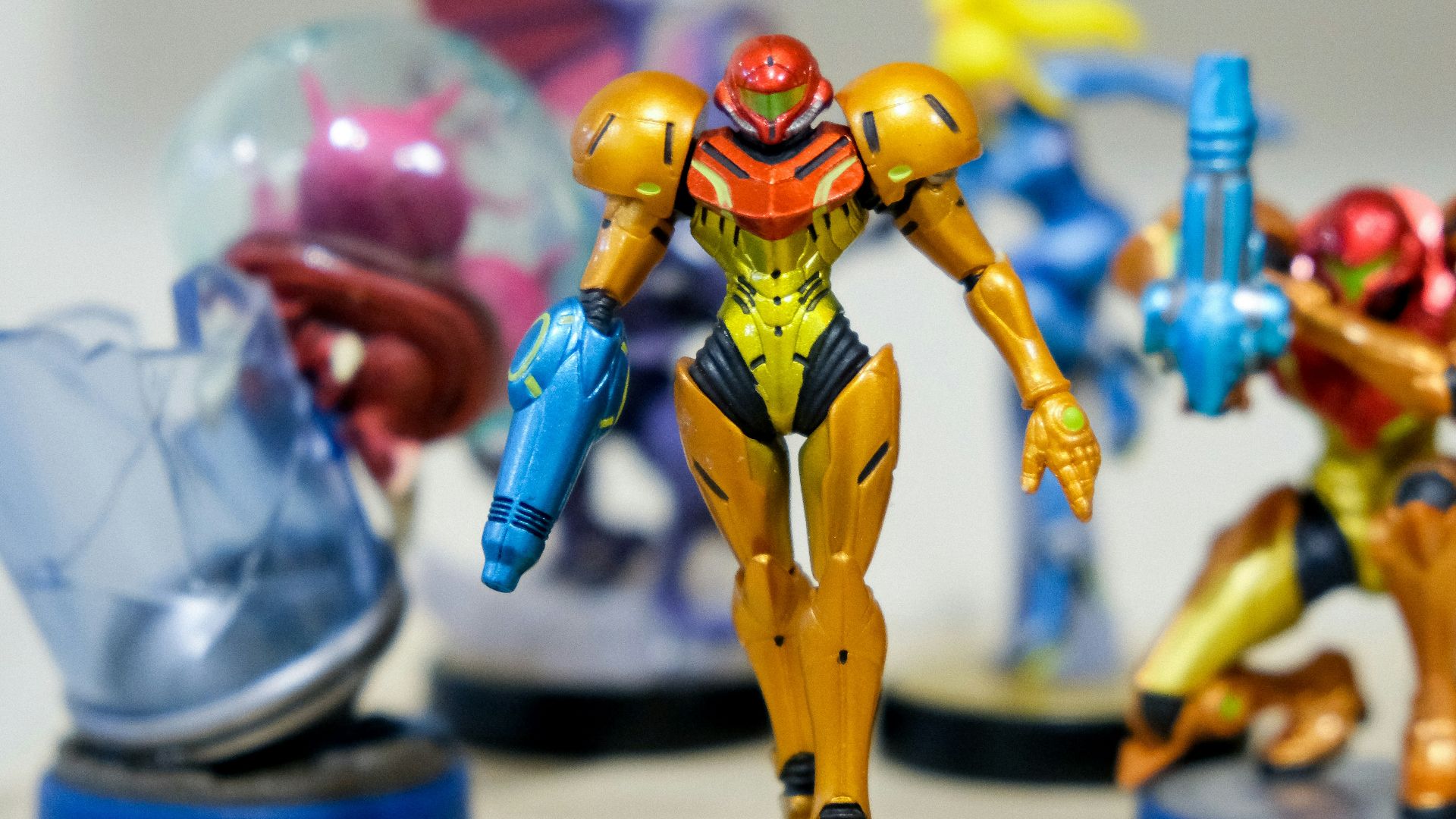 man wearing yellow and red costume character scale model