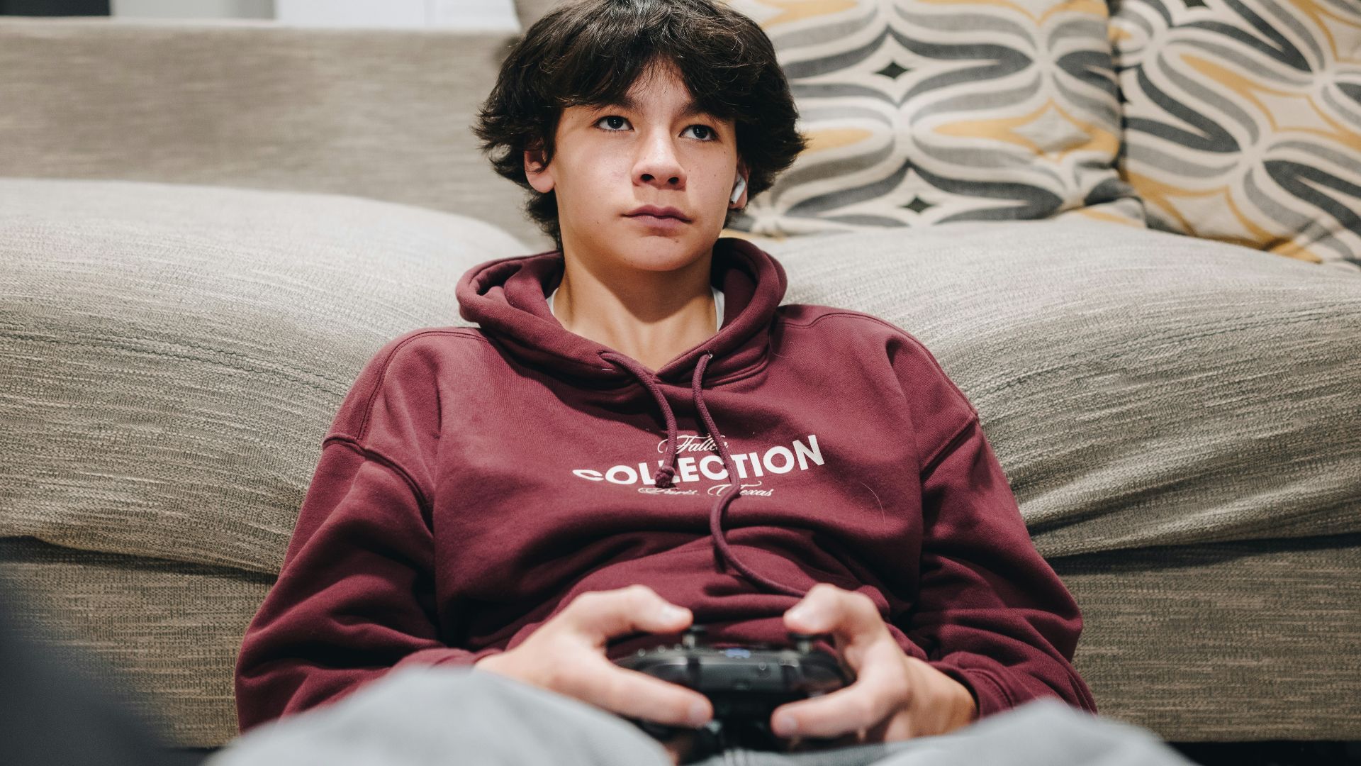 A young boy is playing a video game.