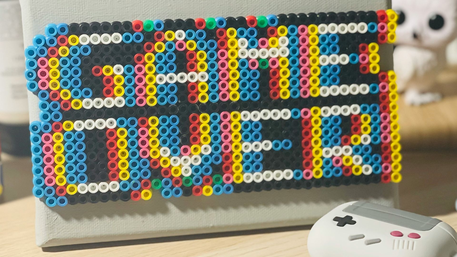 a nintendo wii game controller sitting on top of a table