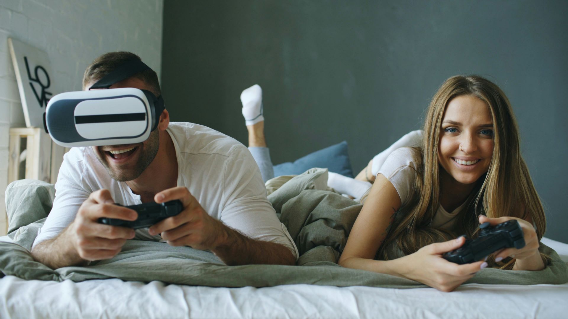 Couple playing video games with vr headset