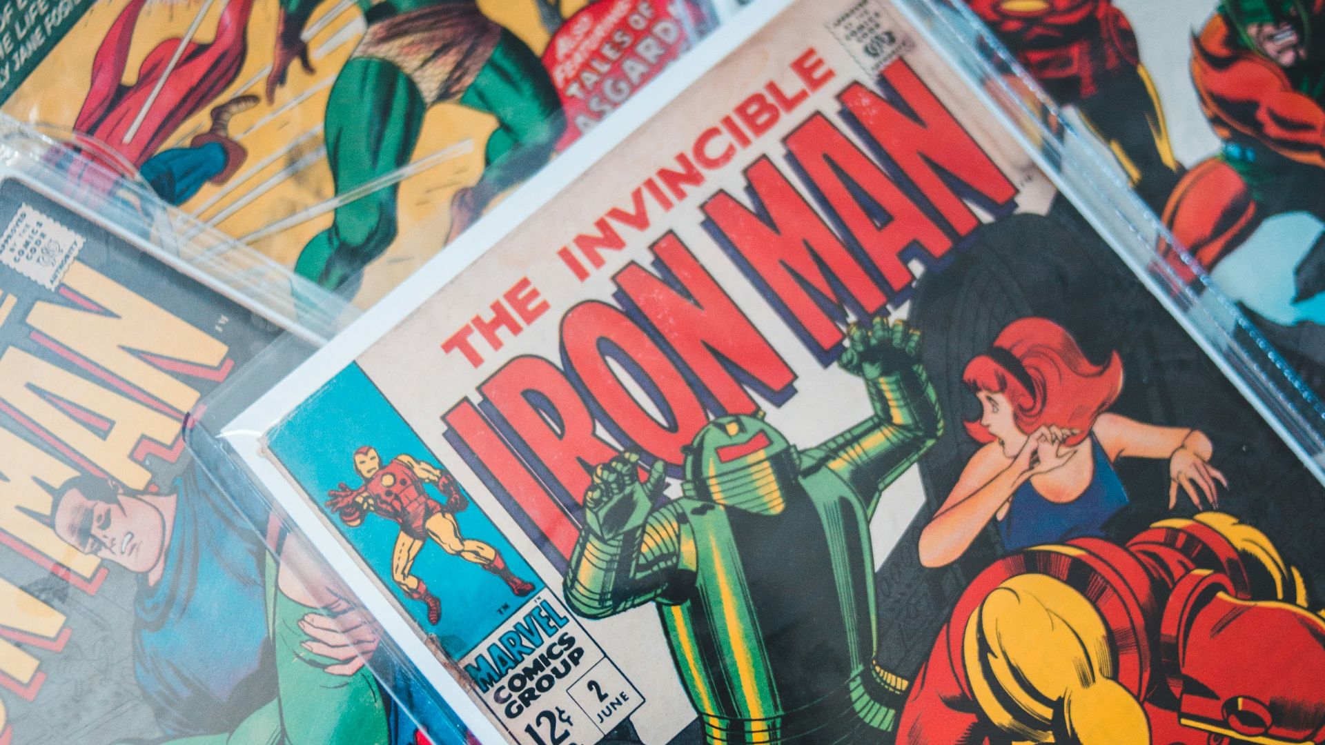 a pile of comics sitting on top of a table