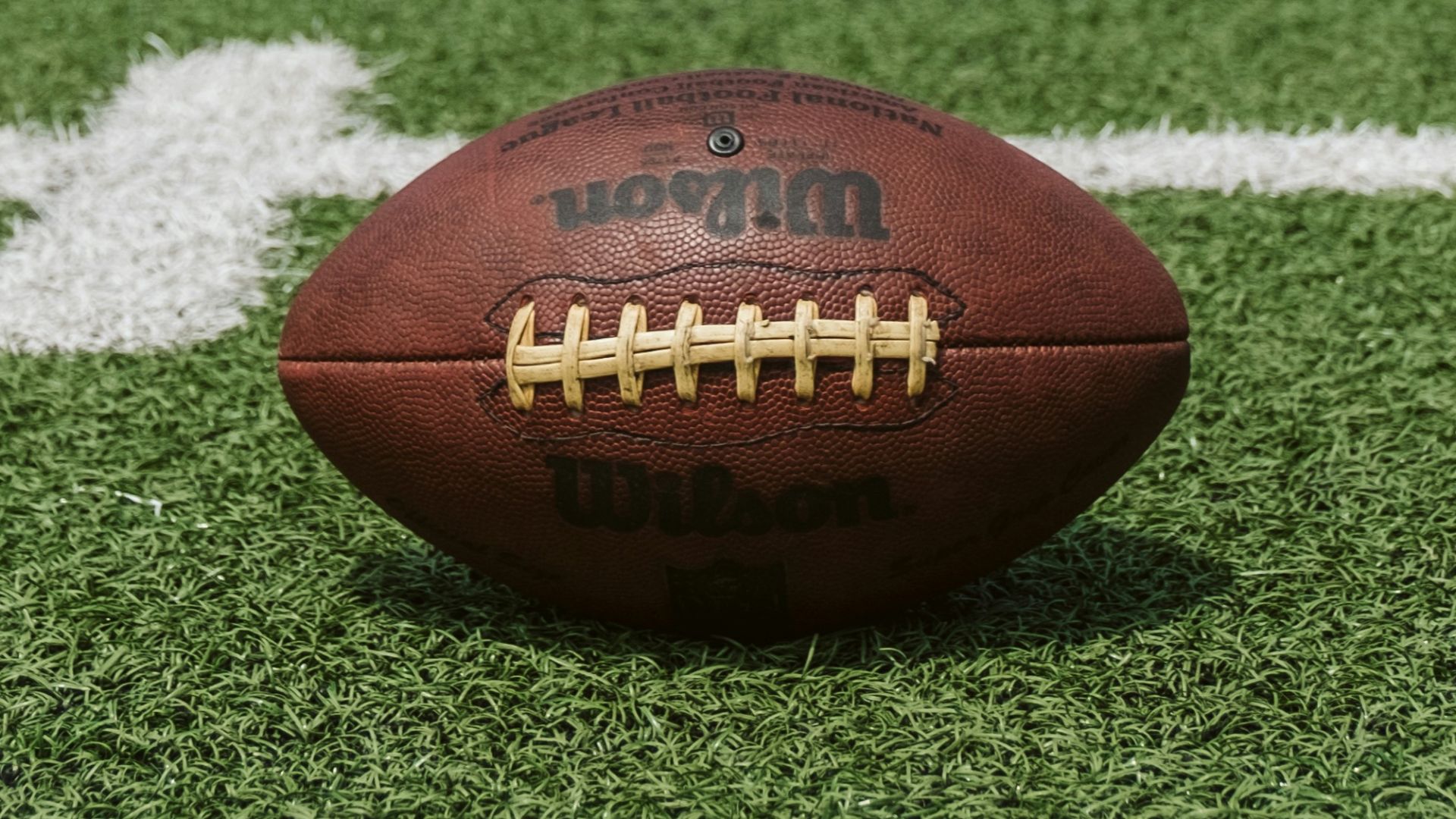 brown and black Wilson football