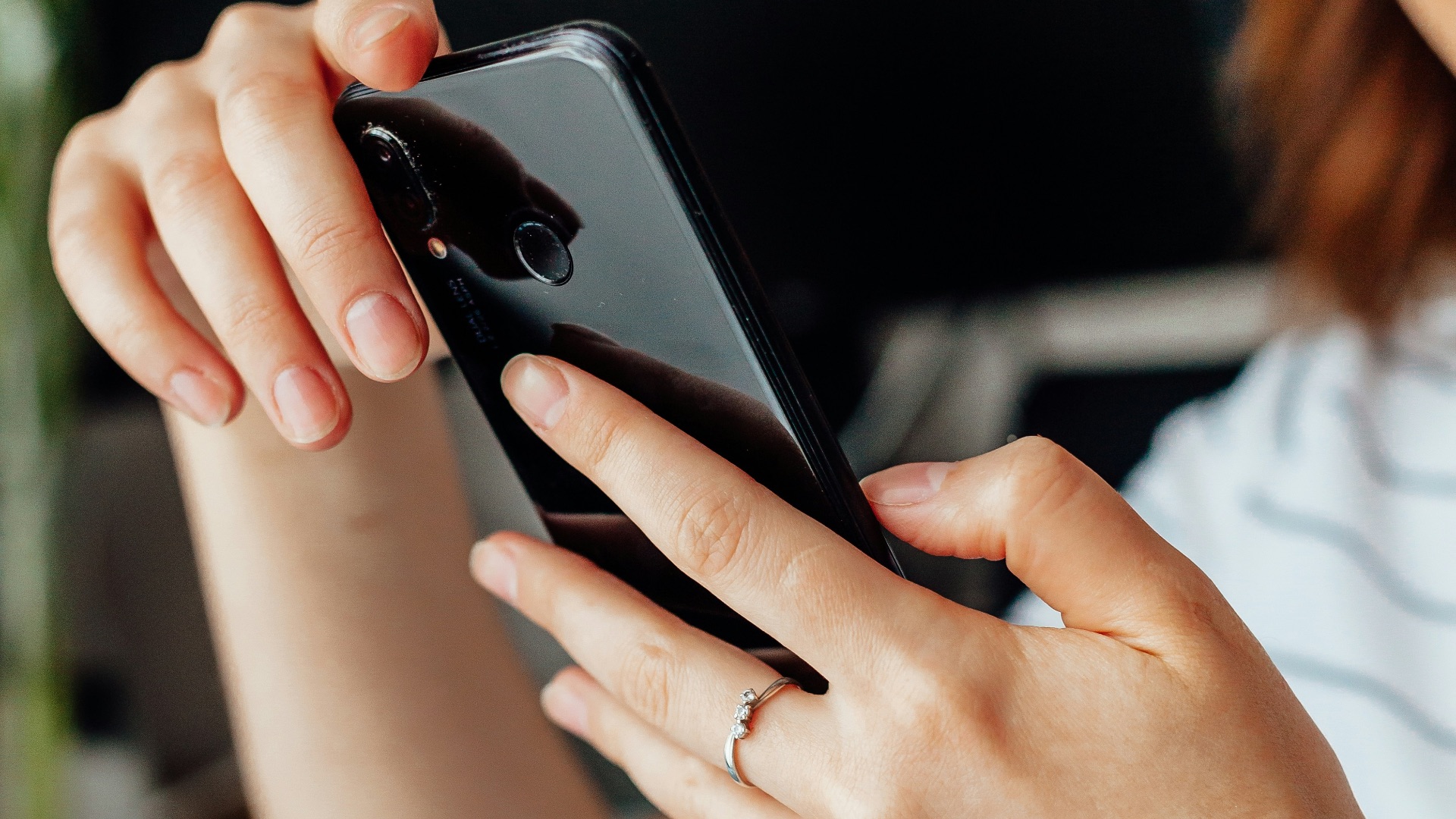 a close up of a person holding a cell phone