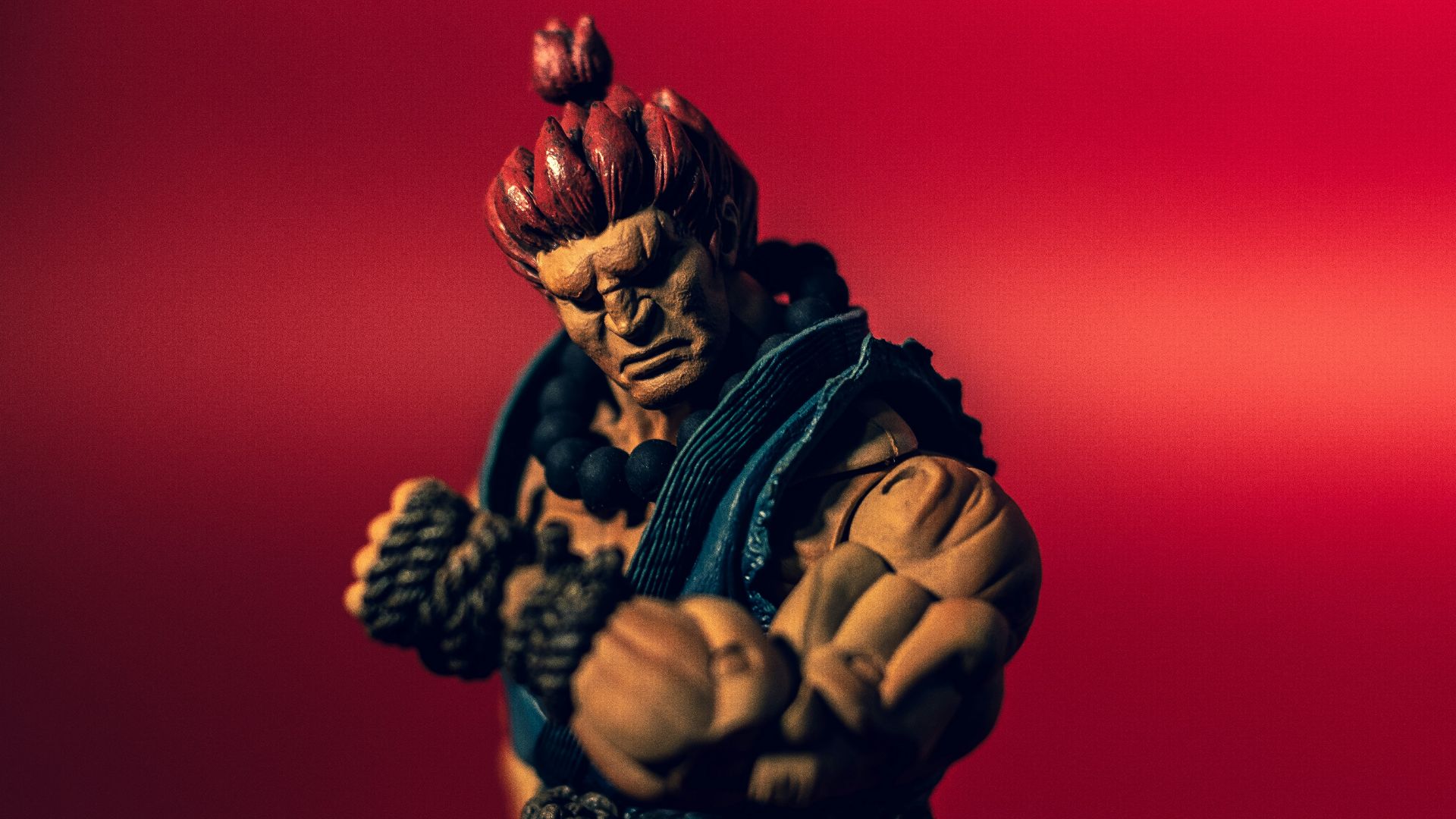 gold dragon figurine in black and yellow striped long sleeve shirt