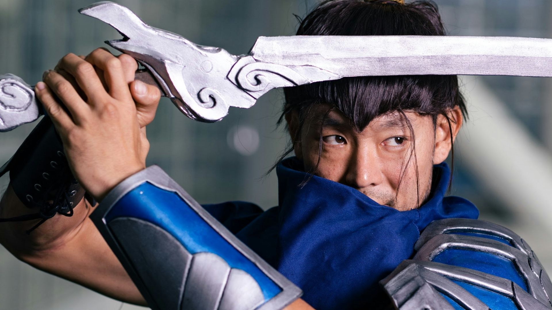 a man in a costume holding a sword