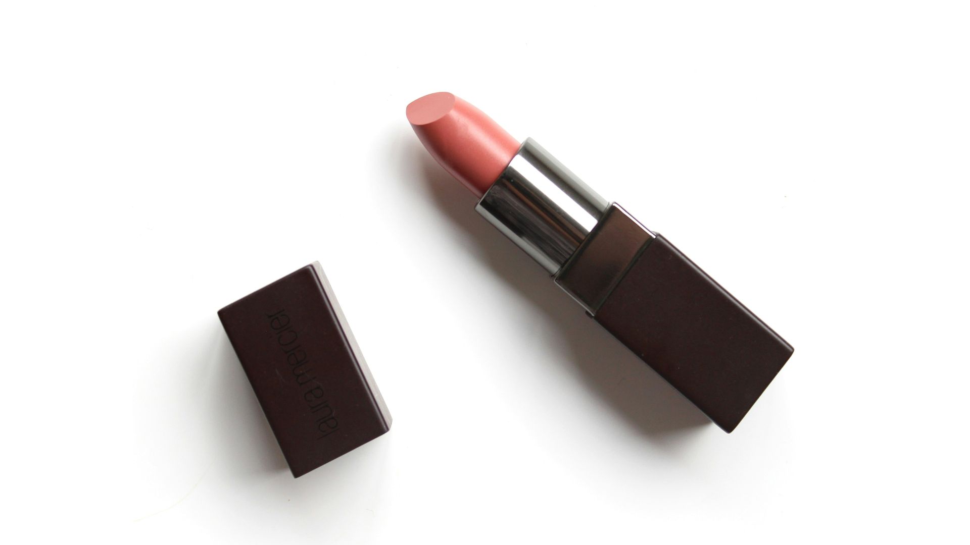 red lipstick on white surface