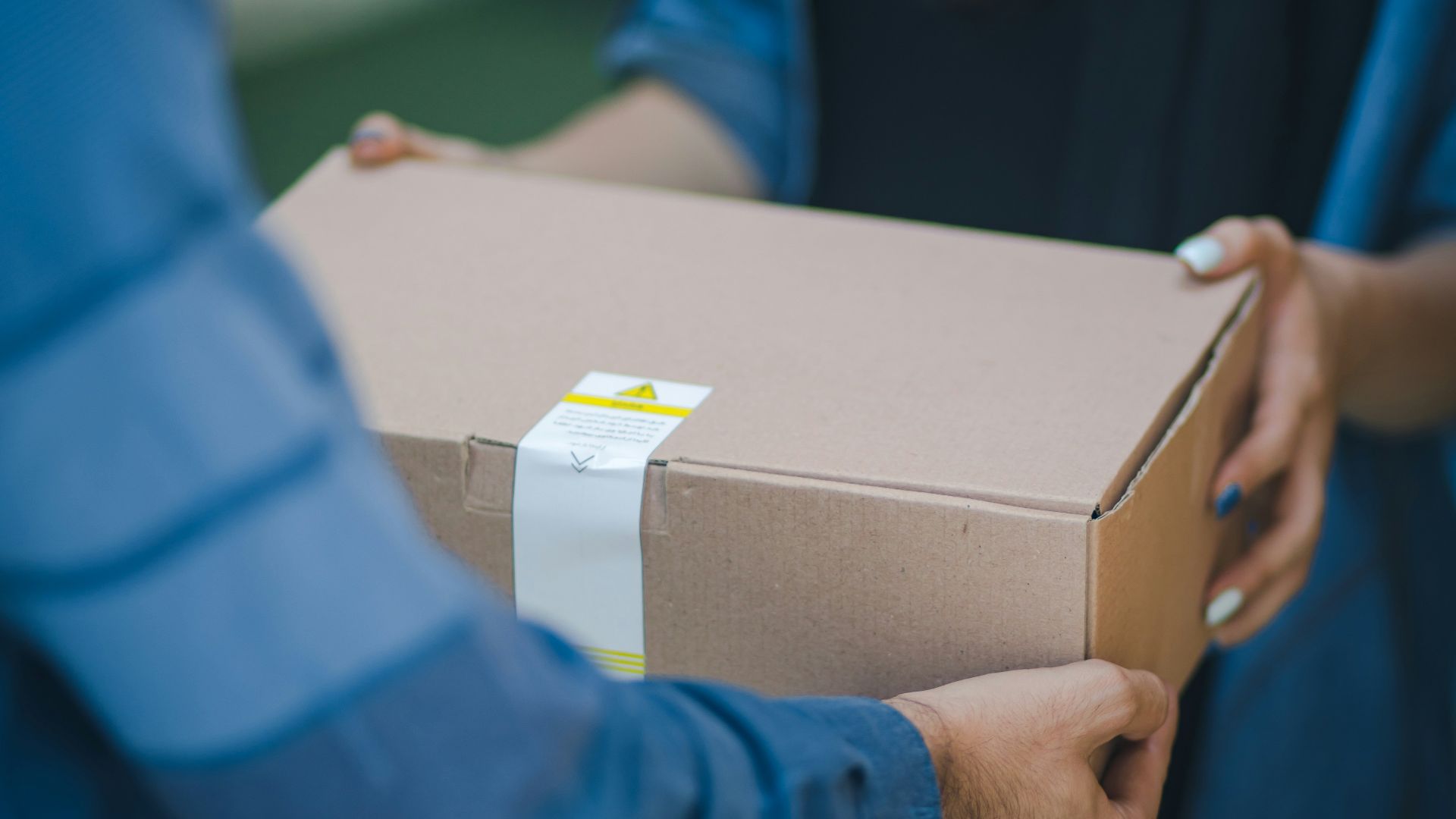 person giving brown box