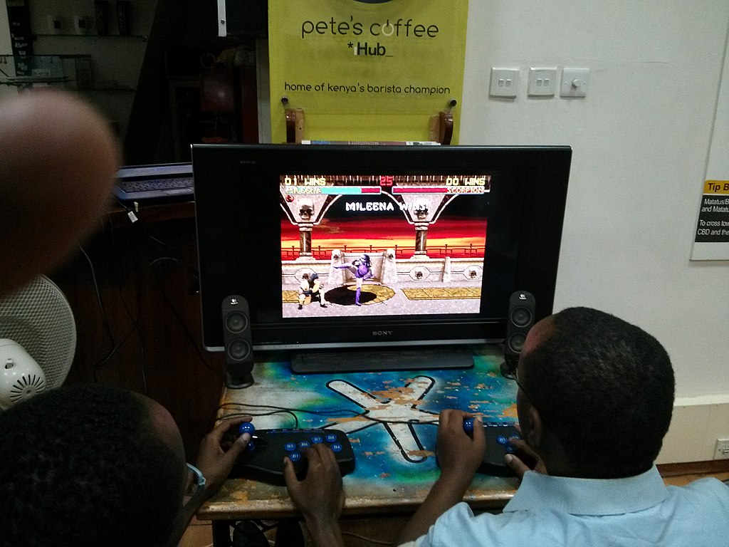 1024px-Gamers_playing_Mortal_Kombat_at_a_Nexgen_gaming_event_in_Nairobi-2.jpg