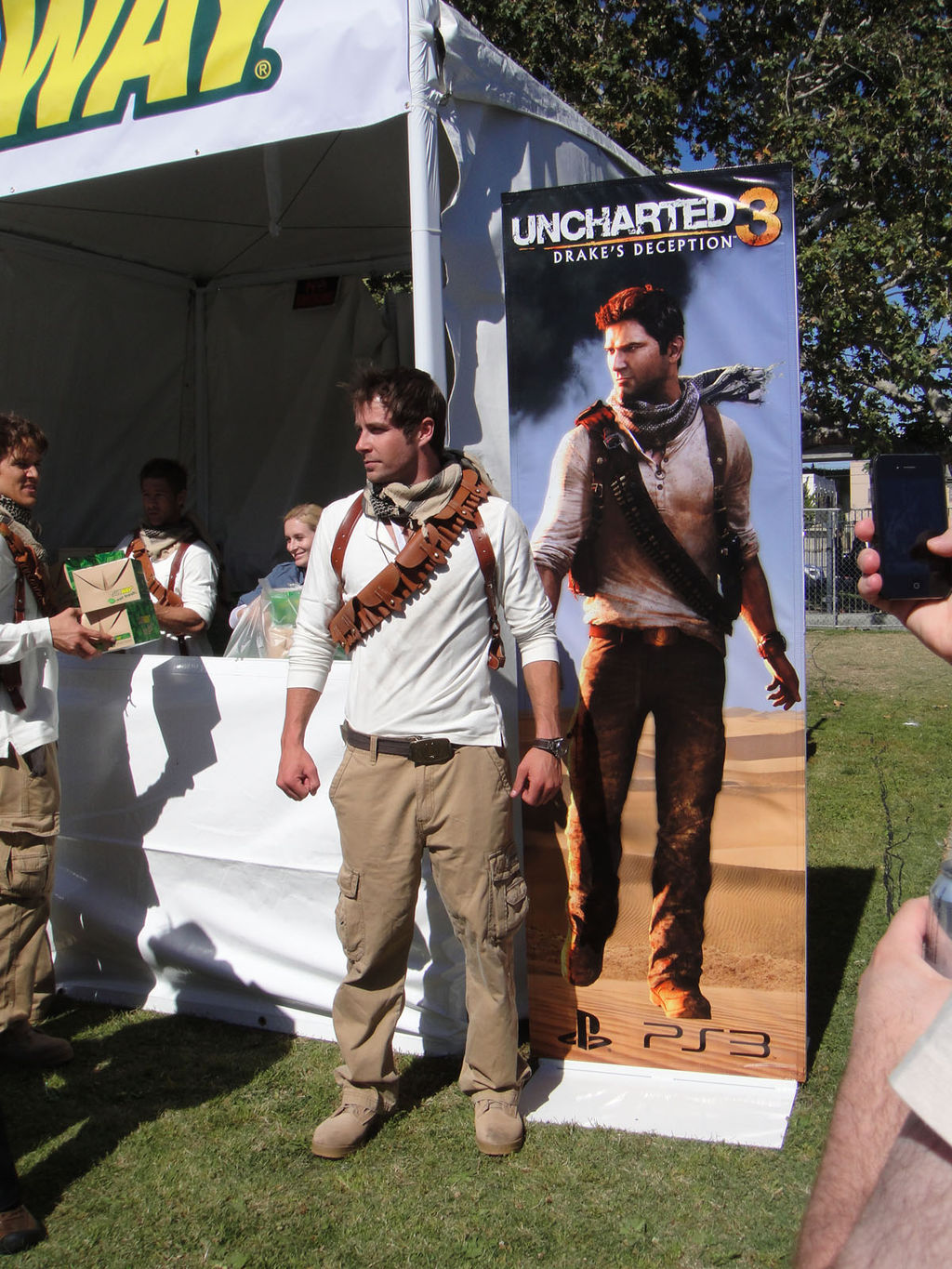 1024px-e32011-sonymediaevent-nathandrakefromunchartedposeswithhisbanner5811251794-2.jpg
