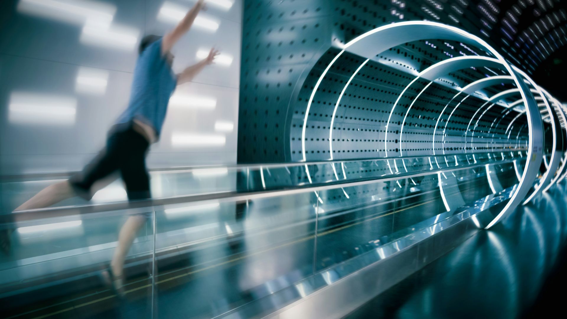 man jumps on escalator