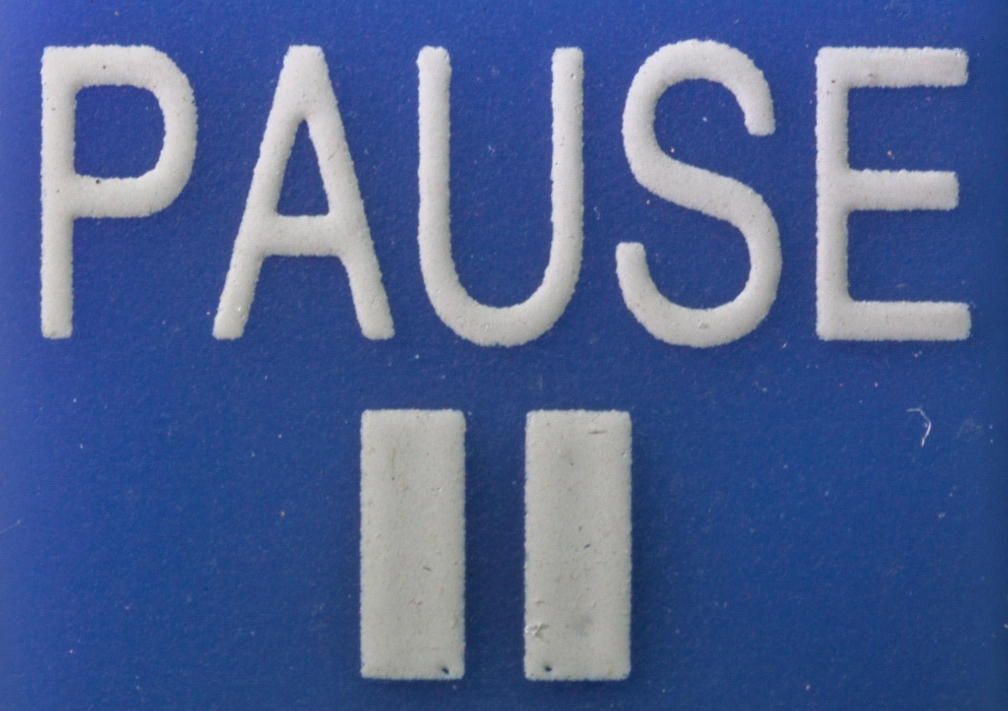 PAUSE-button_-_Macro_photography_of_a_remote_control.jpg
