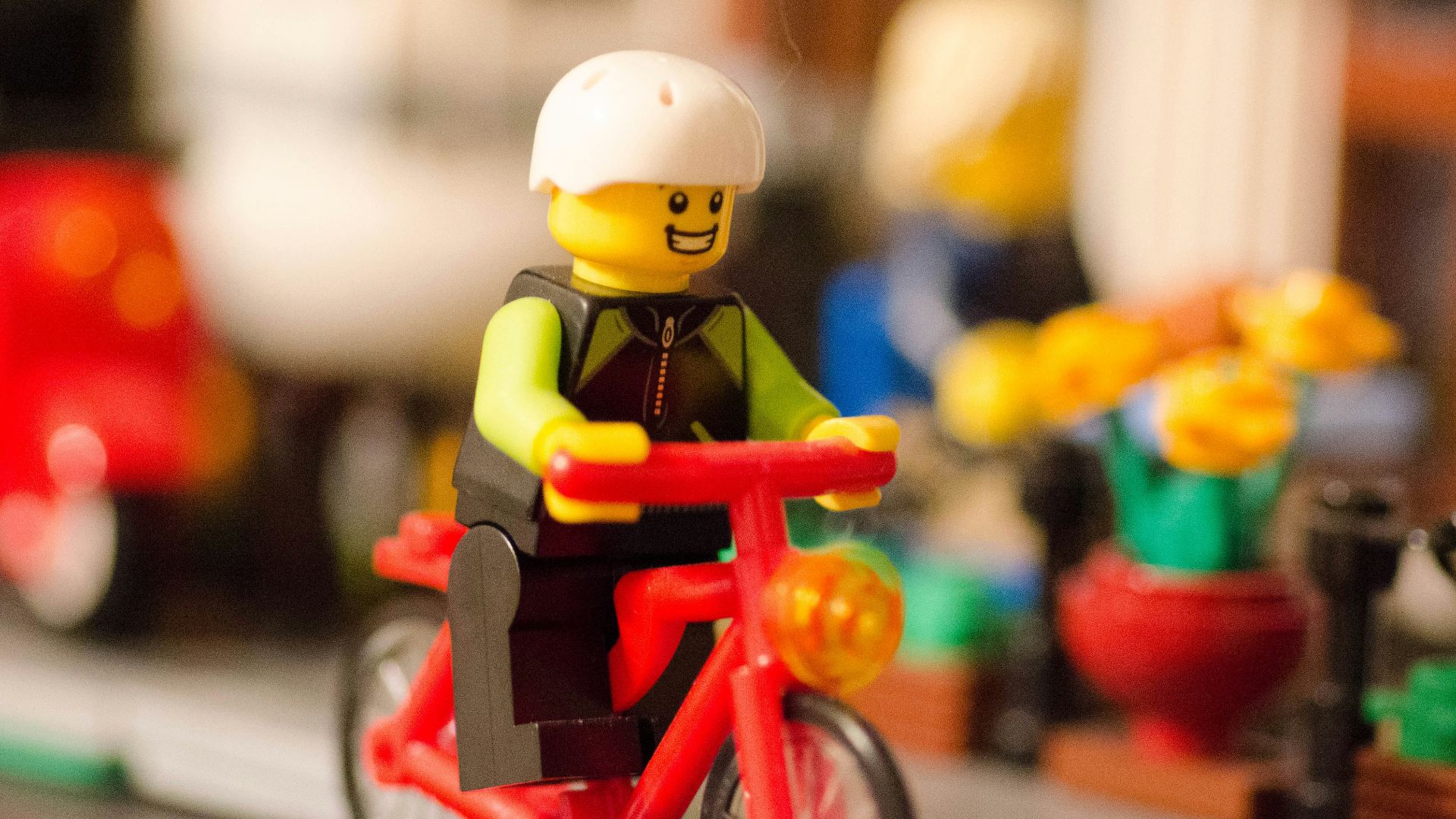 LEGO character riding bicycle