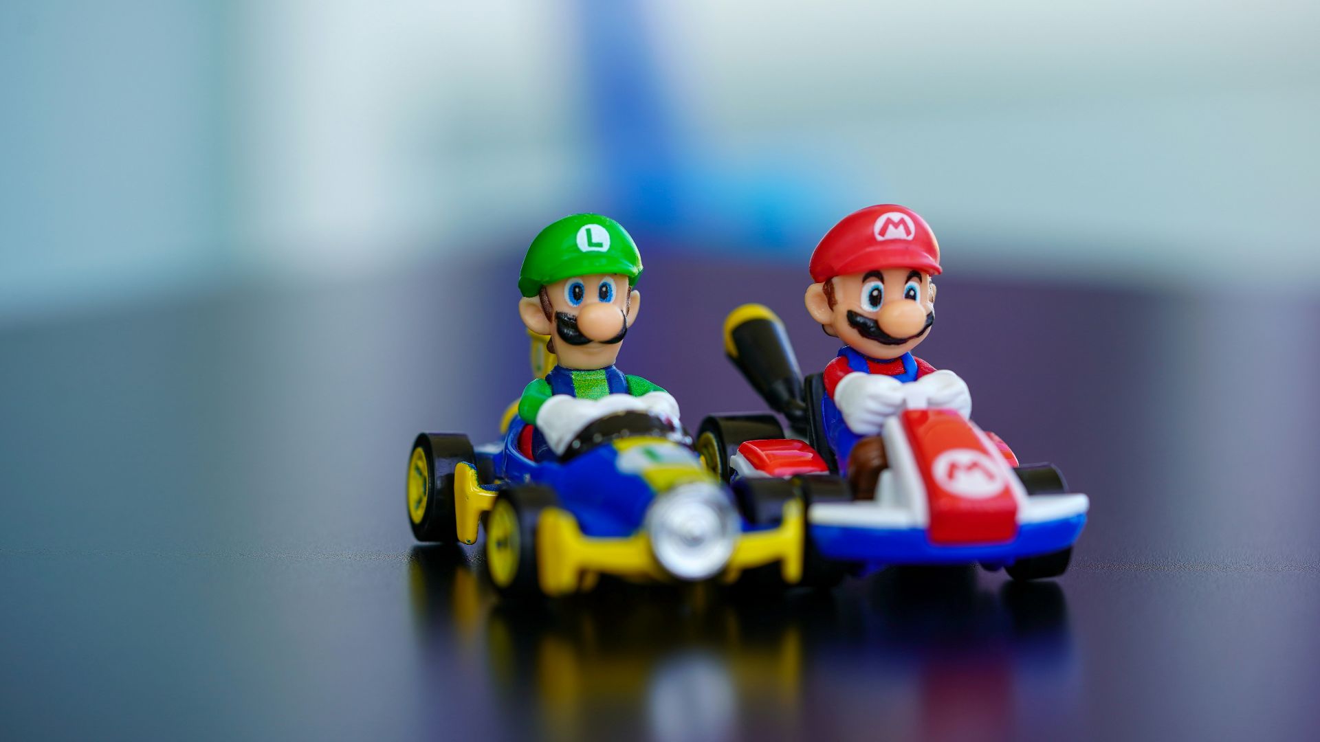 lego mini figure riding blue and red toy car