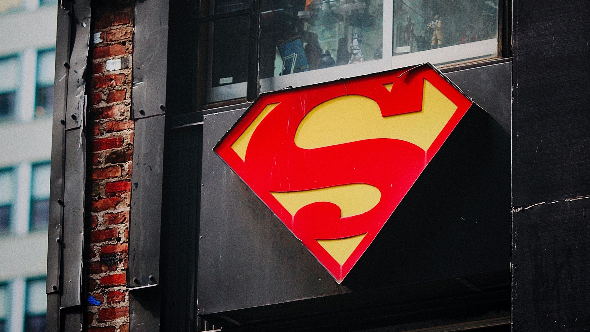 red and yellow heart sticker on black wooden door