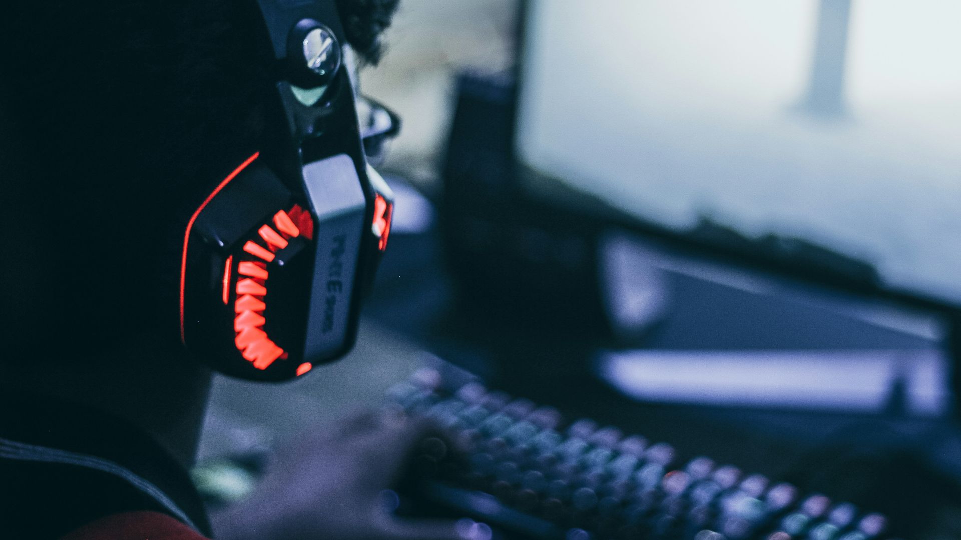 person wearing orange and black headphones