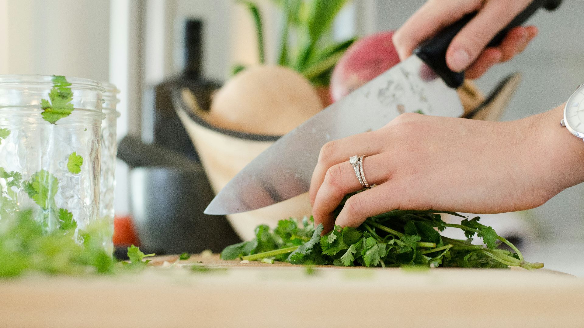 person cutting vegetables with knife