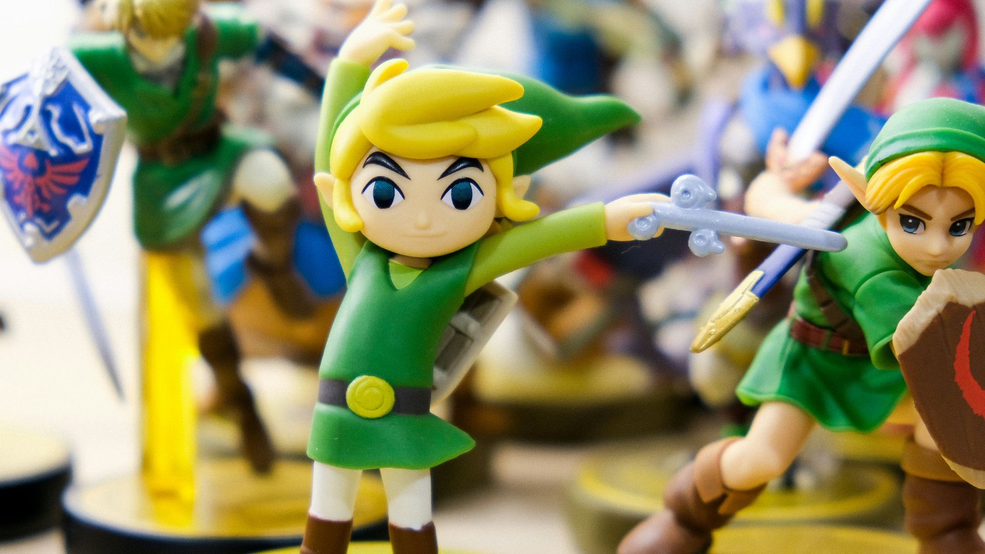 selective focus photography of Link vinyl figures
