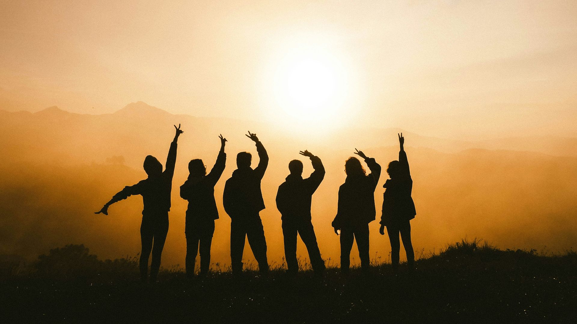 silhouette photo of six persons on top of mountain