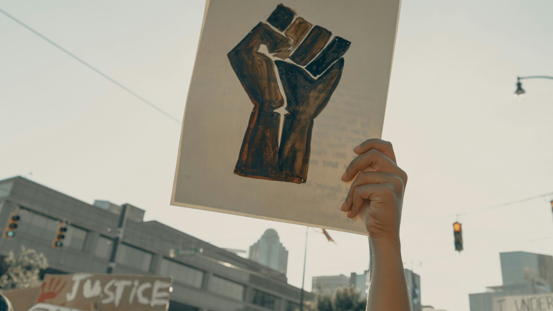 person holding brown wooden frame
