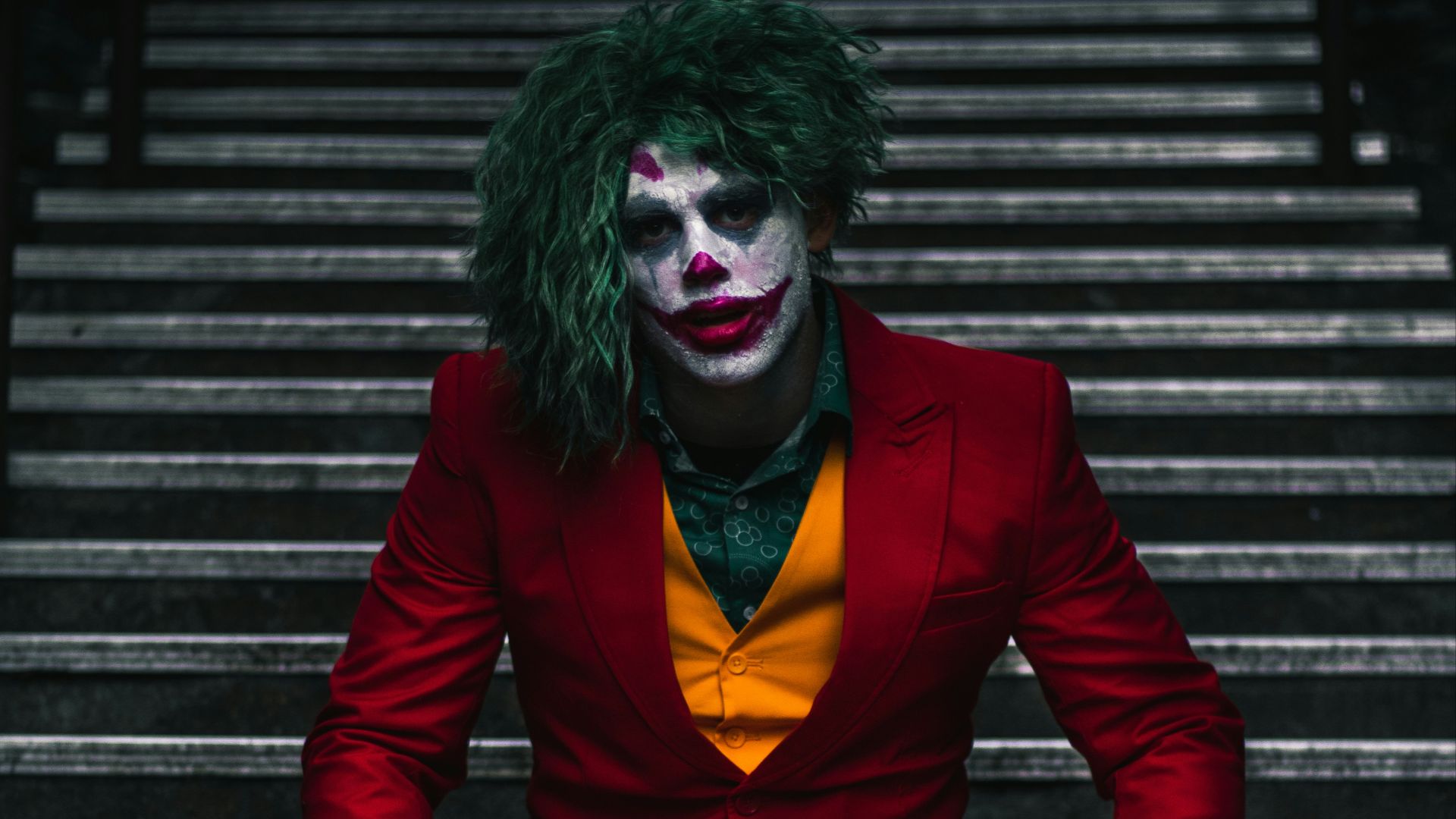 Joker sitting on stairs
