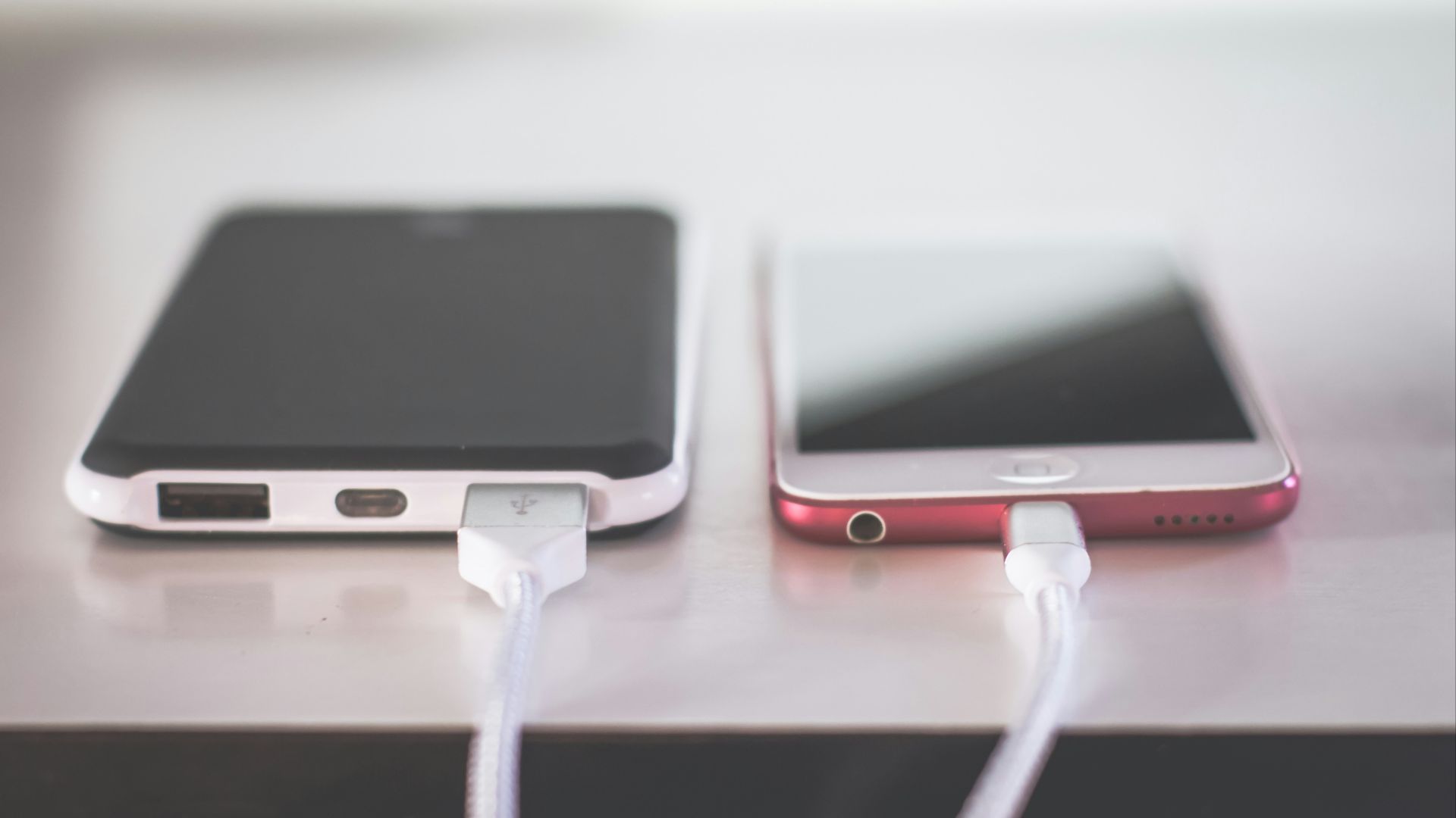 two phones on white table