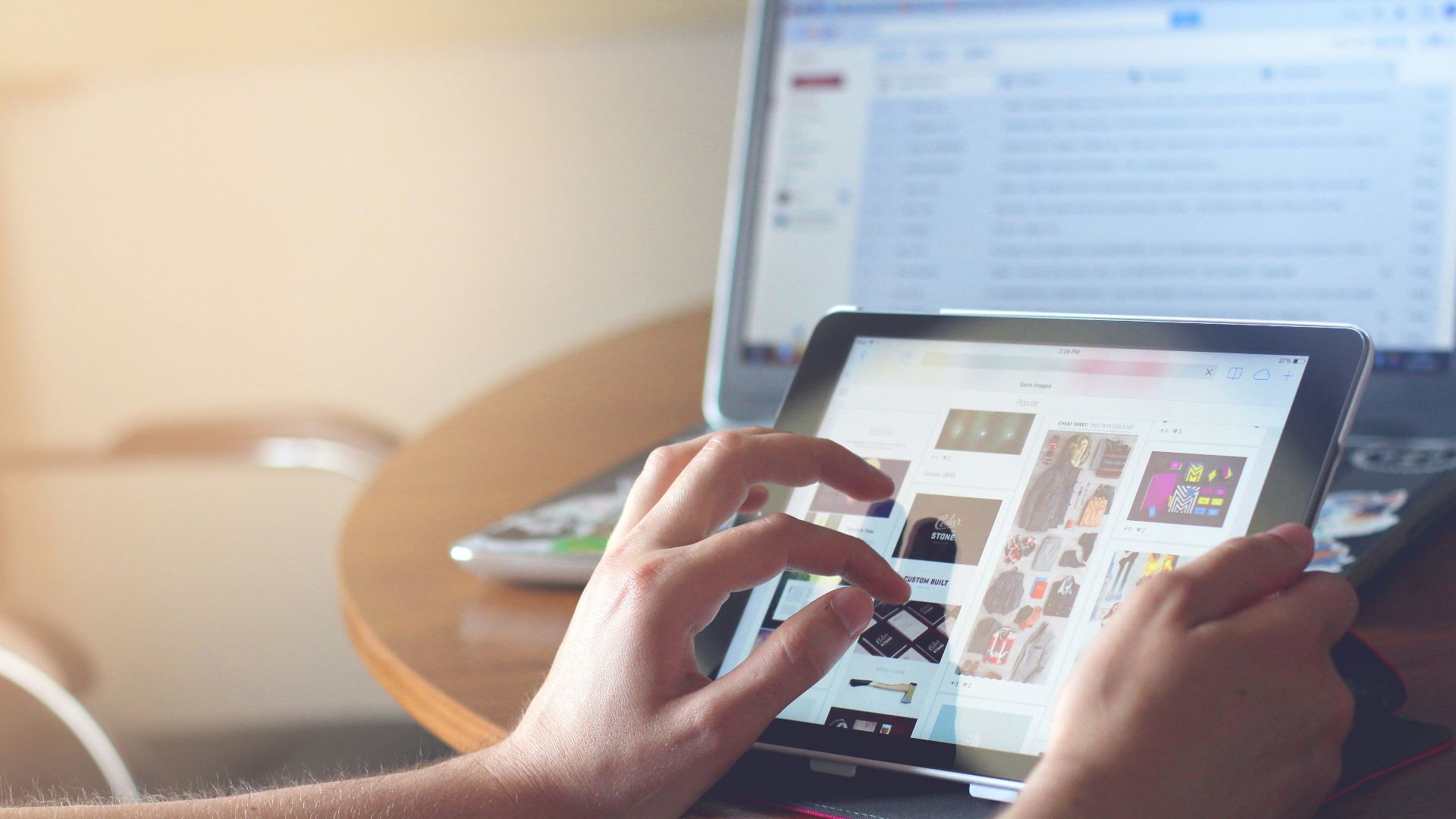 person holding black iPad