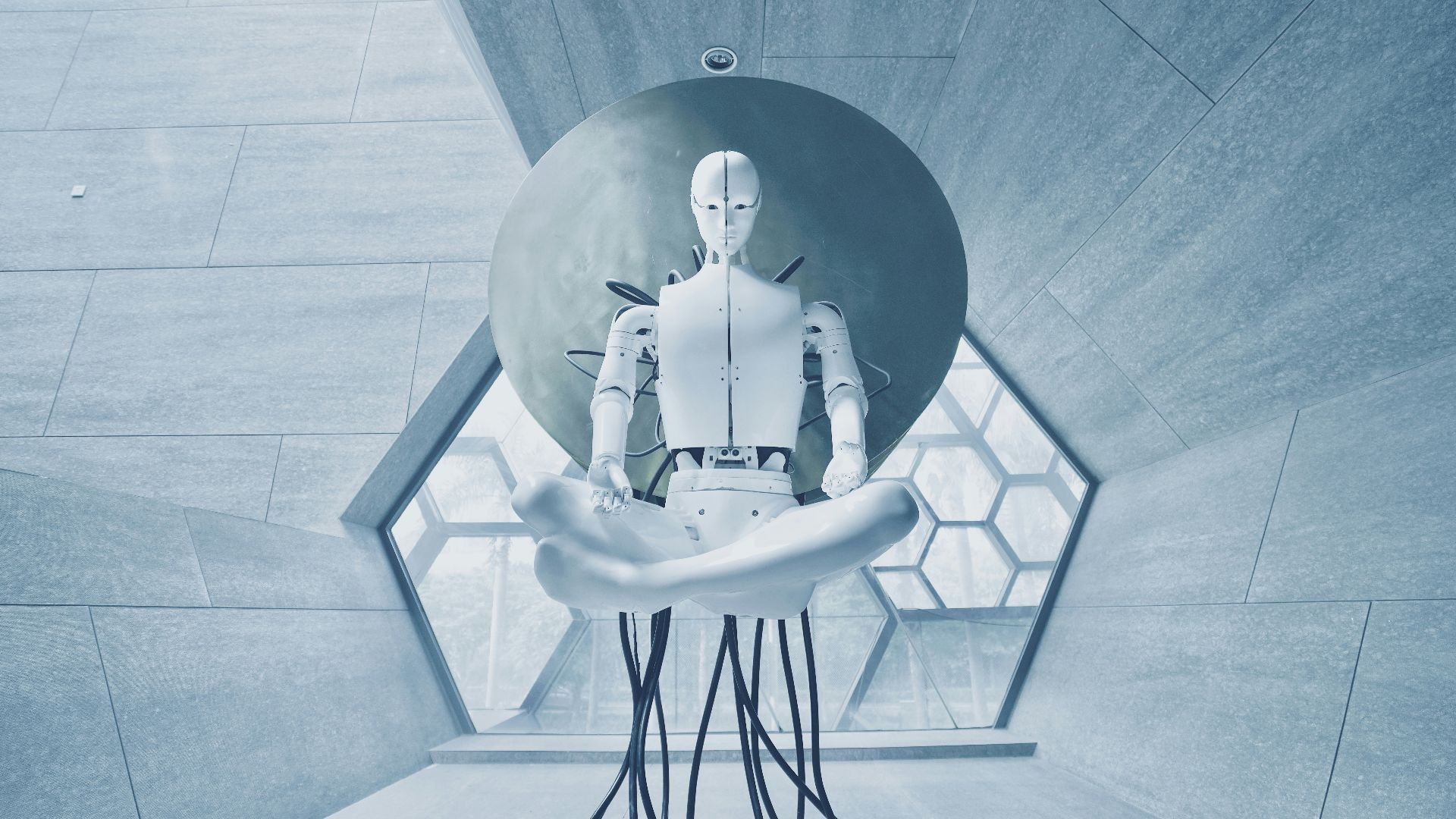 man in black jacket sitting on white chair