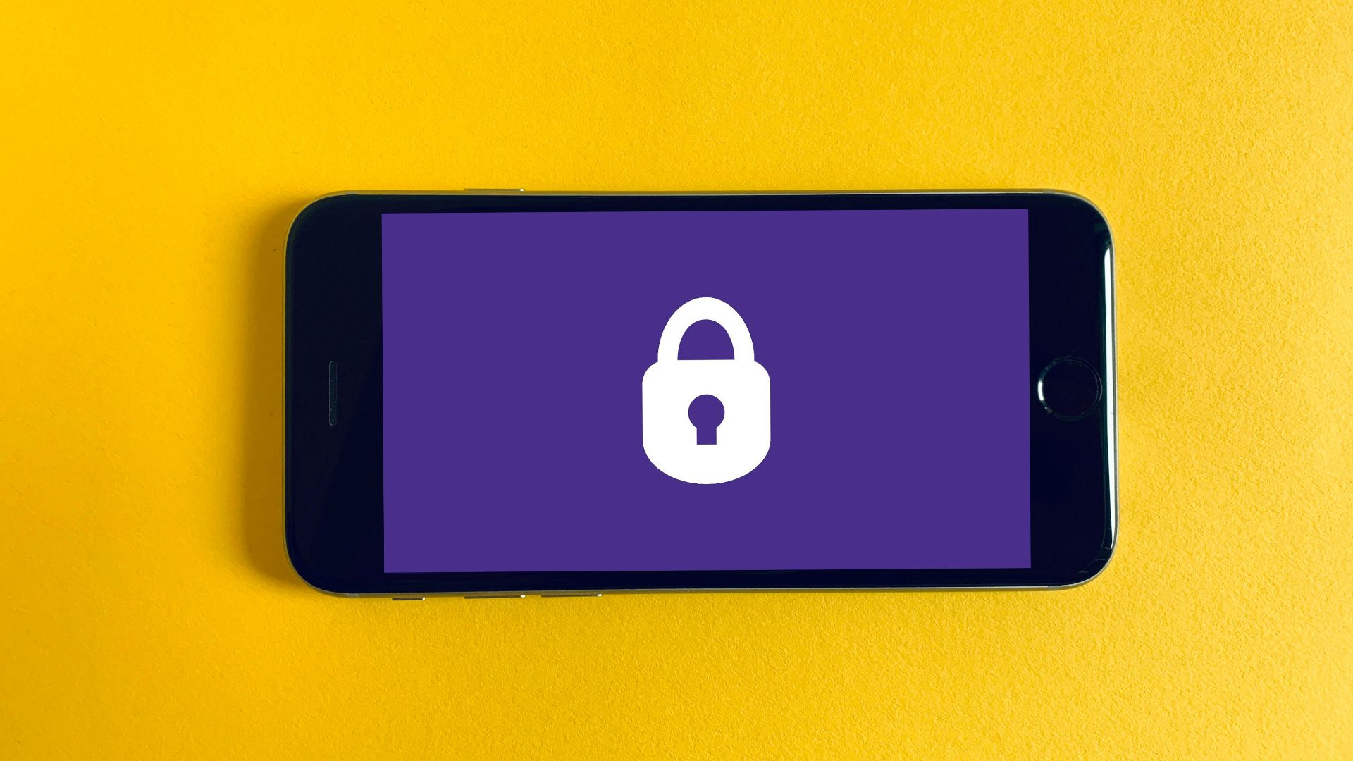 black iphone 5 on yellow textile