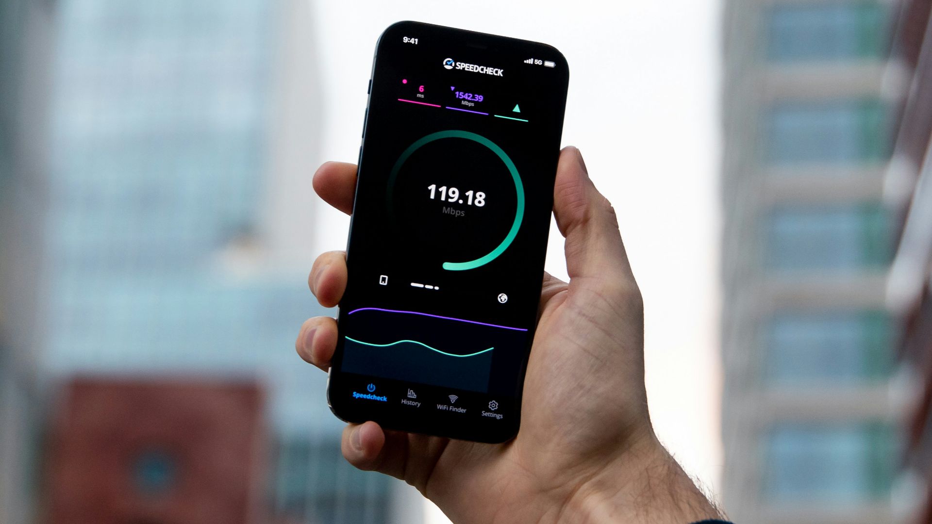 a person holding a cell phone in their hand