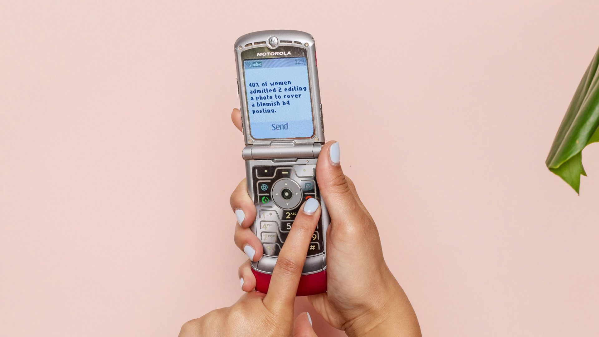 turned-on silver flip phone