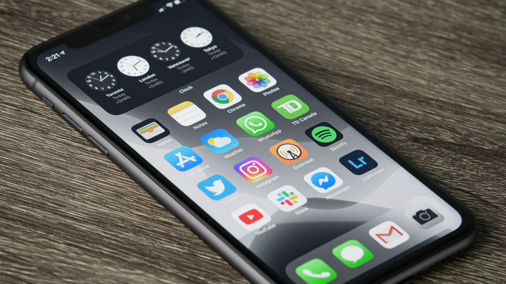 black iphone 5 on brown wooden table