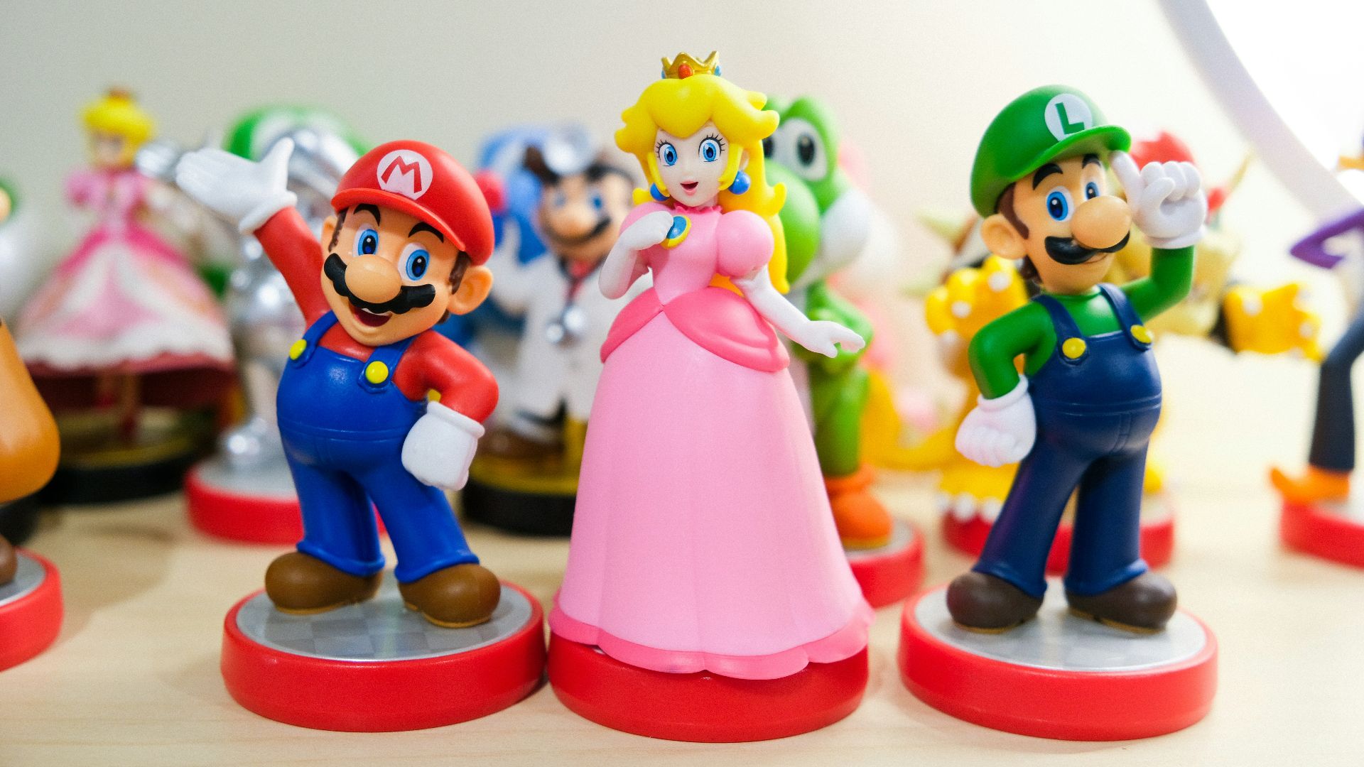 Mario, Luigi, and Princess Peach figurines