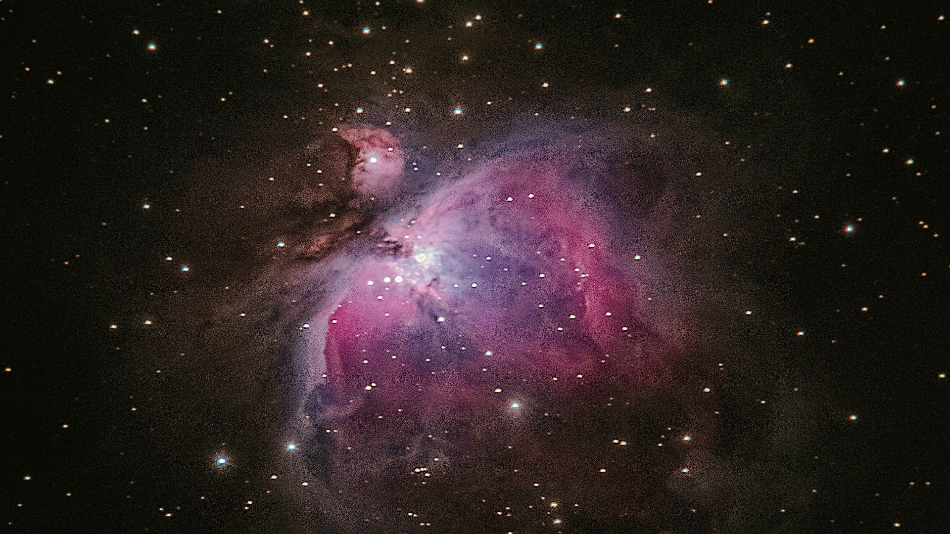 two stars in the middle of a black sky