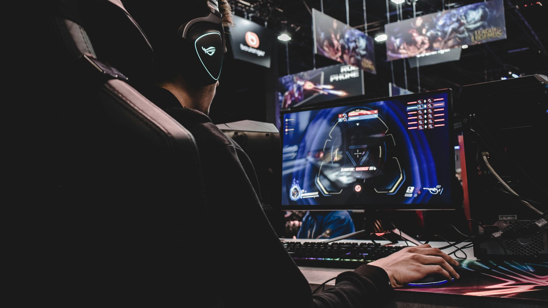 person sitting on gaming chair while playing video game